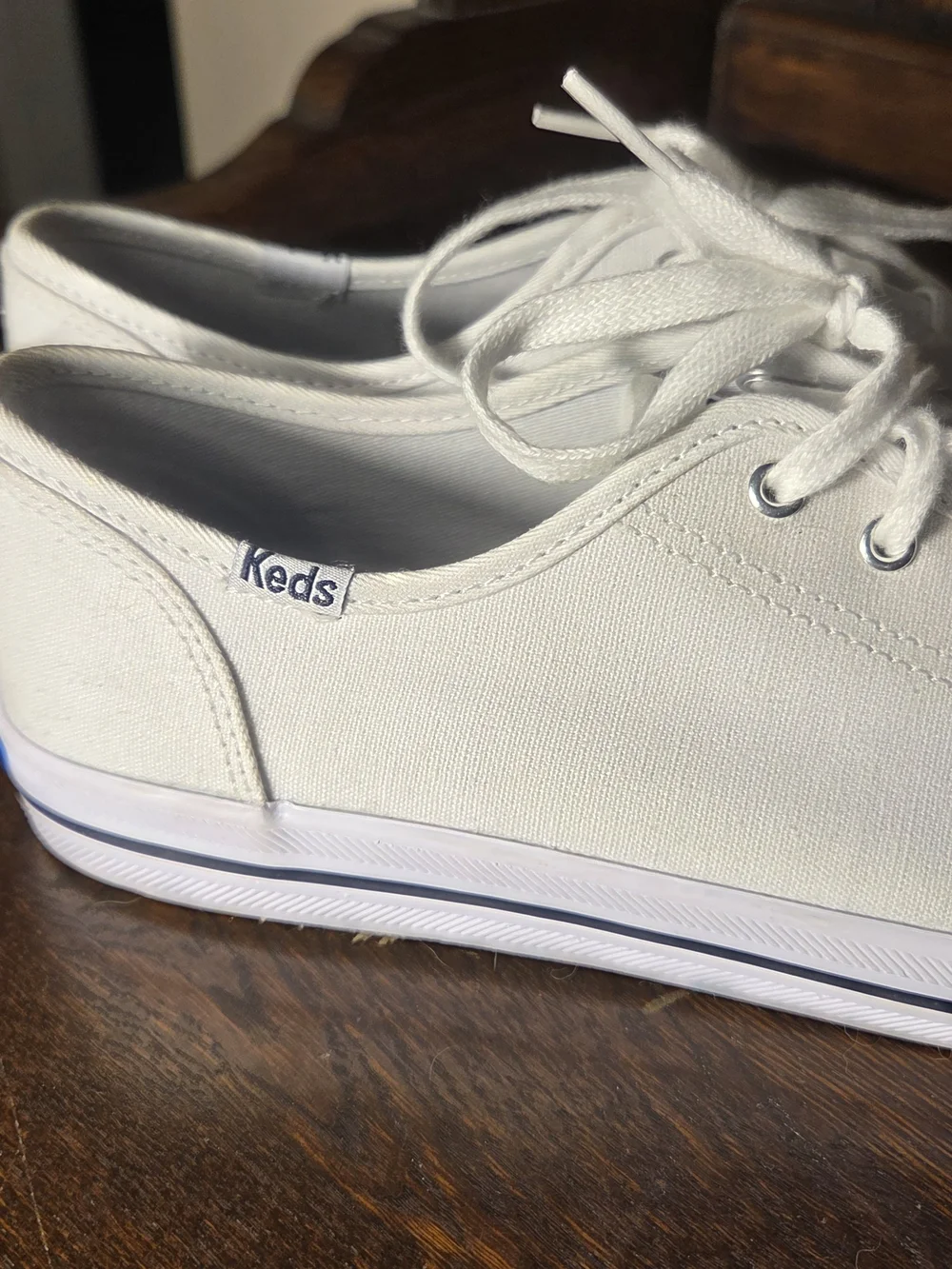 Keds Women's White Kickstart Canvas Low-Top Sneakers with Subtle Blue Trim.